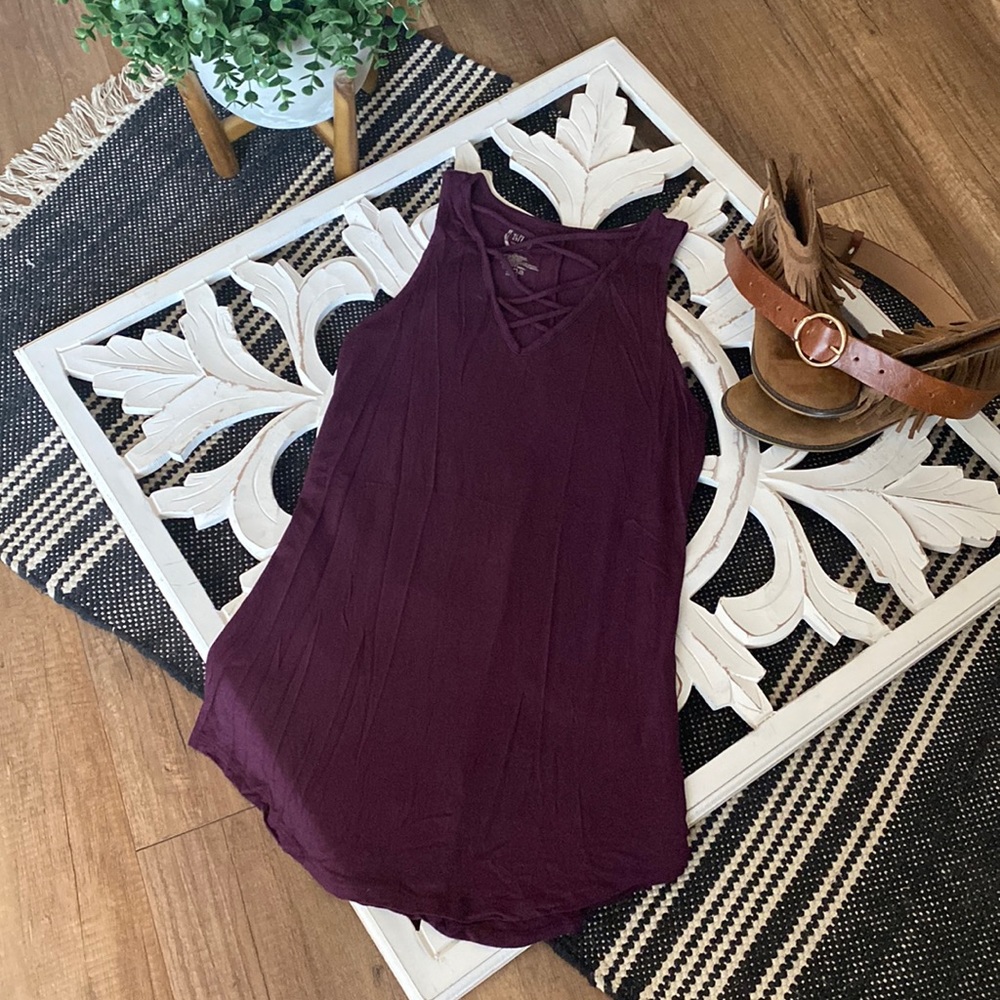 Maurice’s dark purple top with crisscross detail in size xs.